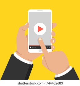 Hands holding smartphone and touching screen. Video player on screen. Vector illustration.