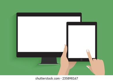 Hands holding tablet computer with blank screen. Tablet computer is connected to secondary display.