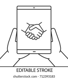 Hands holding tablet computer linear icon. Online business deal. Thin line illustration. Tablet computer with handshake. Contour symbol. Vector isolated outline drawing. Editable stroke