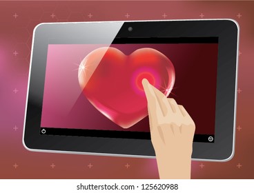 Hands holding a tablet and touch heart