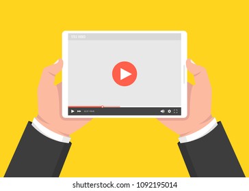 Hands holding tablet and touching screen. Video player on screen. Vector illustration.