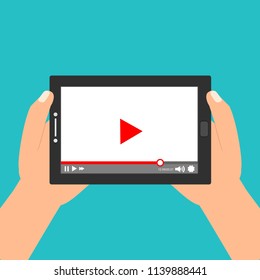 Hands holding tablet with video player on screen. Vector flat illustration