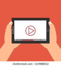 Hands holding tablet with video player on screen. Vector flat illustration