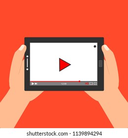 Hands holding tablet with video player on screen. Vector flat illustration