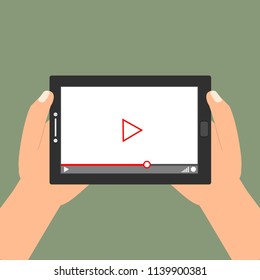 Hands holding tablet with video player on screen. Vector flat illustration