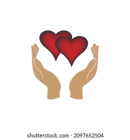 Hands holding two hearts, a symbol of love and harmony on a white background. Vector image.