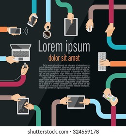 Hands holding various high-tech devices. Inter wined hands as a metaphor for  electronic wires.Concept illustrating  business meeting. Brainstorming. 