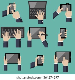Hands holding various hi-tech computer and communication devices icons 