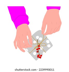 Hands Holding and wrapping present box in gray paper with holly berry branch. Preparing Christmas, New year, birthday, Valentine's Day gift. Vector flat illustration isolated on white background