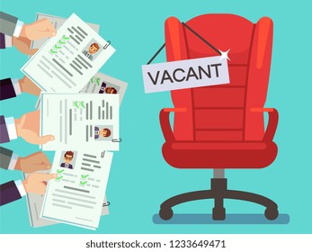 Hands holds CV forms and office chair with vacancy plate