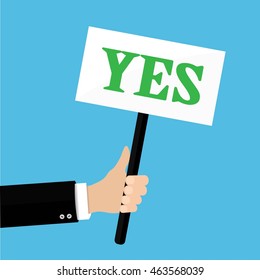 Hands holds sign with YES word. Vote, positive reaction, happiness