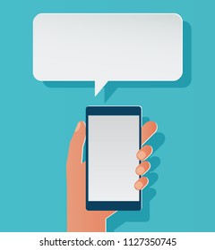 Hands holing smartphone with blank speech bubble for text. Chat icon, message on smartphone. Messaging concept for web banner, web site, infographics. Creative paper flat design vector illustration