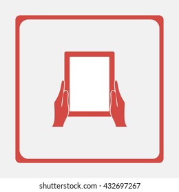 Hands holing tablet computer with blank screen.