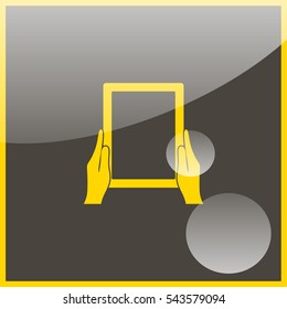 Hands holing tablet computer with blank screen.