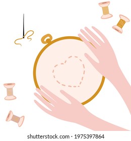  
hands with hoop for embroidery on the white background