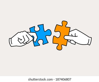 Hands joining jigsaw puzzle pieces. Friends, partners in harmony concept.