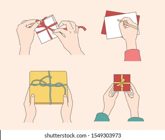 Hands making a gift wrap. Hand writing a letter. Close-up hand drawn style vector design illustrations. 