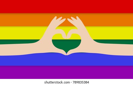 Hands making a heart on rainbow flag background. LGBT love support.
