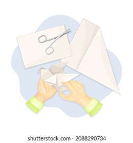 Hands making origami out of paper. Top view of creative work process, hobby and craft concept vector illustration