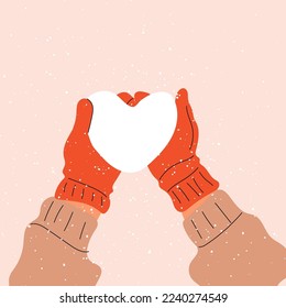Hands in mittens hold a heart made of snow. Love, Valentine's Day.