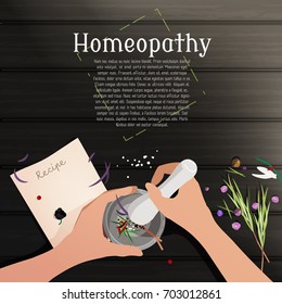 Hands with mortar and pestle with herbs and berries inside on wooden table. The paper with recipe, flowers and herbs, rosemary. Top view. Homeopathy, alternative medicine, pharmacy background