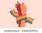 Hands of non-binary couple holding LGBT flag symbolizing love and unity between transgender and gay or lesbian. Pride month concept to promote the idea of tolerance towards LGBT people.
