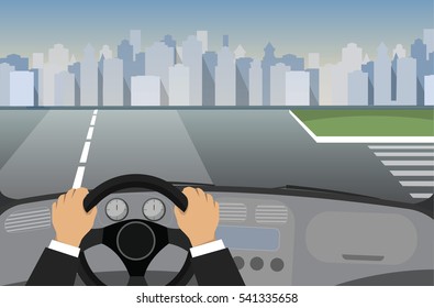 Hands on the wheel of a car