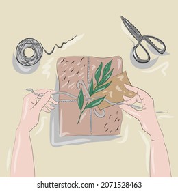 hands pack a gift for a holiday in eco-packaging