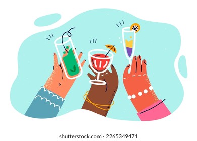 Hands of people with glasses of alcoholic fruit cocktails during party in club or on beach. Hands with different skin colors with glasses filled with cocktails and drinks for Friday party