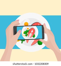 Hands with the phone close-up pictures of food. Food blogger.