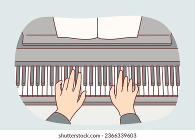 Hands of pianist playing classical composition on piano during symphony concert at opera house. Musician uses keyboard musical instrument and wishes to become professional composer or pianist