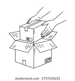 Hands placing a small box into a larger open cardboard box with flaps