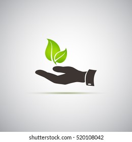 Hands and plant icon on a gray background.