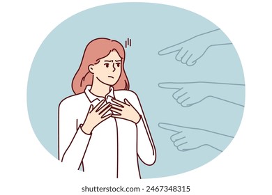 Hands pointing at puzzled girl for concept blame and condemnation person who made mistake. Unhappy girl suffers from unreasonable blame of colleagues or friends motivated by hatred or discrimination