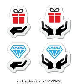 Hands with present and diamond icons set 