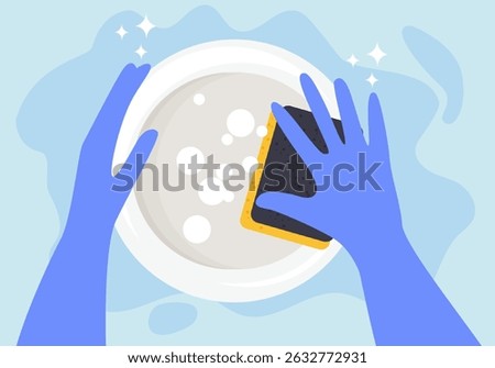 Hands in a purple rubber gloves with a yellow cleaning sponge washing a dish on a blue background with a copy space