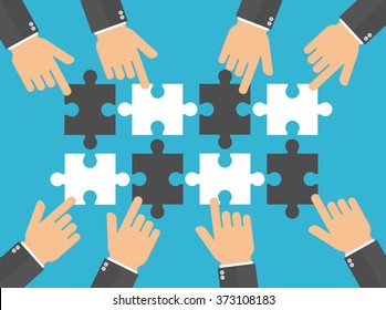 Hands pushing or putting puzzle pieces together. Teamwork concept. Hands pointing to puzzle pieces. Flat design