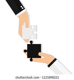 Hands putting puzzle