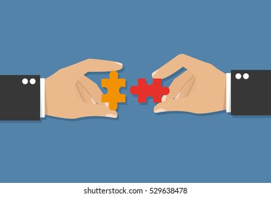  Hands putting puzzle pieces