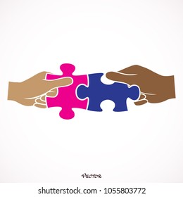 Hands putting puzzle pieces. Teamwork business concept