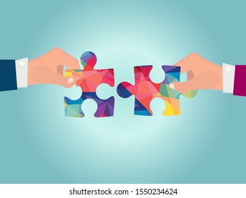 Hands putting puzzle pieces. Teamwork business concept.