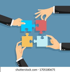 Hands putting puzzle pieces. Teamwork and bussiness concept