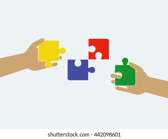 Hands putting puzzle pieces. Teamwork and bussiness concept