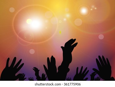 Hands raised up a group of people at the concert