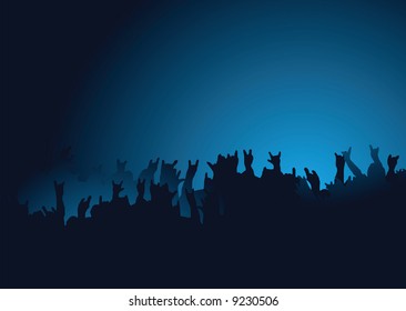 Hands raised at a rock concert with the crown back lit in blue