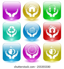 In hands set. Vector set glass buttons.