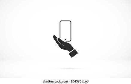 en las manos del icono del smartphone, ilustración vectorial. Estilo de diseño plano