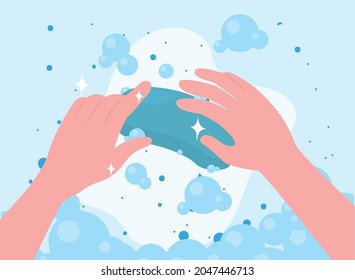 hands with soap on blue background