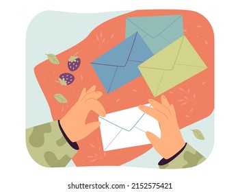 Hands of soldier holding paper envelope. Man in camouflage receiving letter flat vector illustration. Post service, delivery of information concept for banner, website design or landing web page