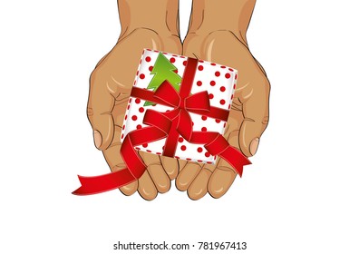 Hands stretch a gift box with a bow and a Christmas tree. View from above. Greeting card or invitation for the New Year holiday.